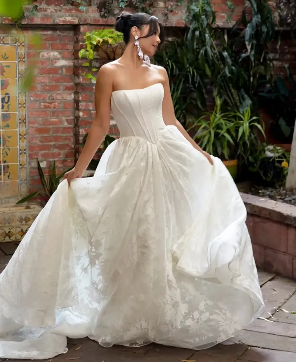 Model wearing a white gown by Essense of Australia