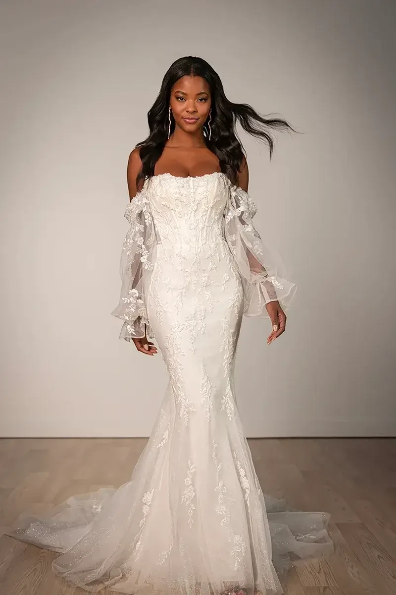 Model wearing a white gown by Stella York