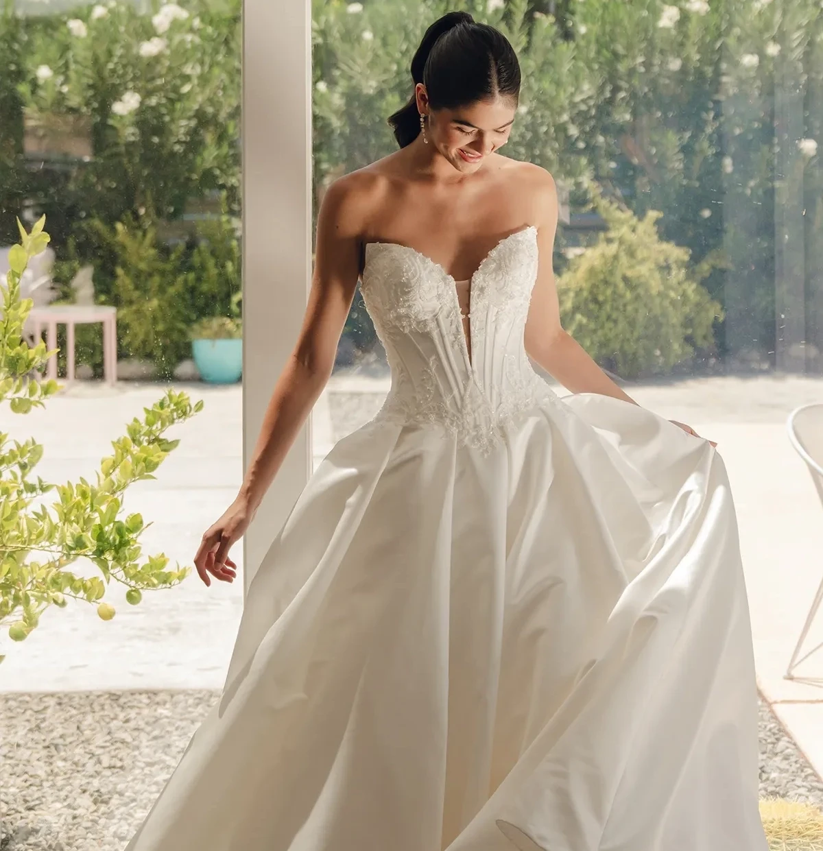 Model wearing a white gown by Stella York